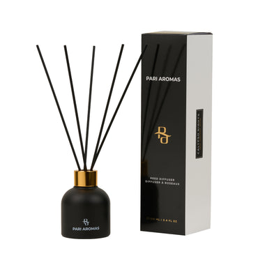 Calypso Nights reed diffuser with neroli, cedarwood, and saffron in a glass bottle with natural fragrance sticks