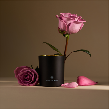 Hand-poured candle featuring pink sugar, peony, and sandalwood for a warm, sultry island-inspired aroma