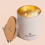 Hand-poured Caribbean Bliss candle with warm notes of pomegranate, clove, and guaiac wood creating a rich, fruity atmosphere
