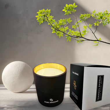 Pari Aromas scented candle with geranium, spearmint, and lemon, a refreshing floral and citrus aroma.