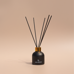 Eco-friendly reed diffuser with peony, pink grapefruit, and strawberry in a phthalate-free formula for long-lasting scent


